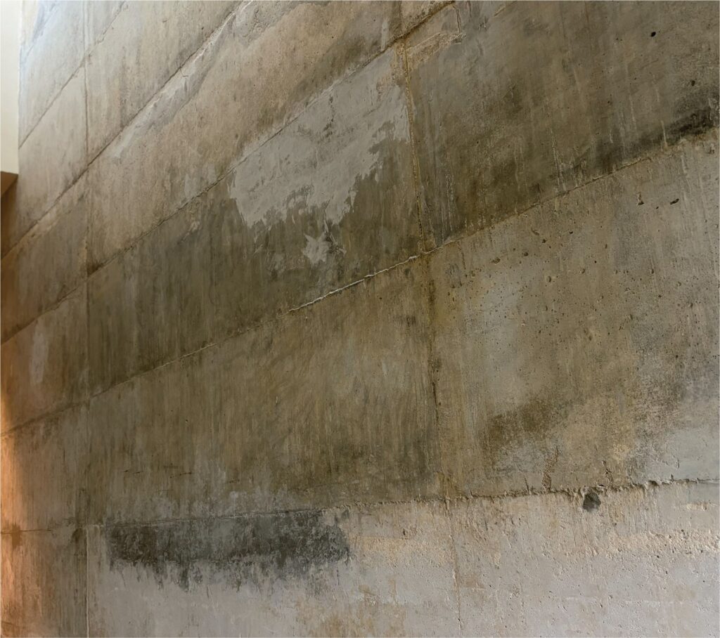 Yellow stains and repair marks on concrete